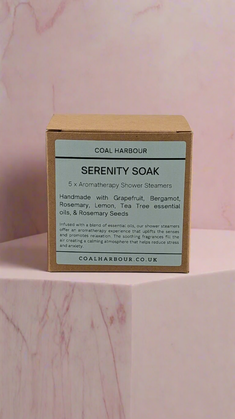 Box of Coal Harbour Serenity Soak on a pink marble background