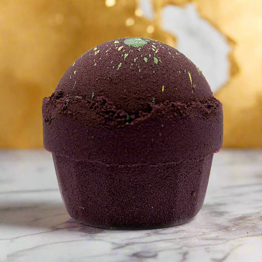 Bath bomb with natural texture and specks on a white background