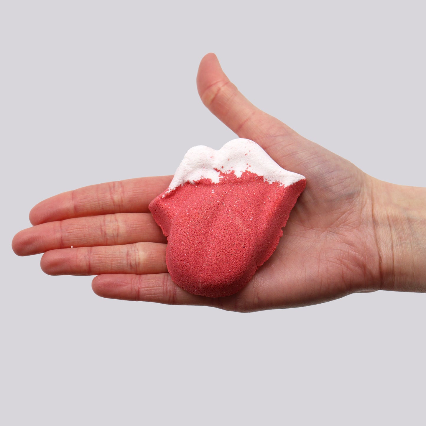 Luscious Lips Bath Bomb in hand