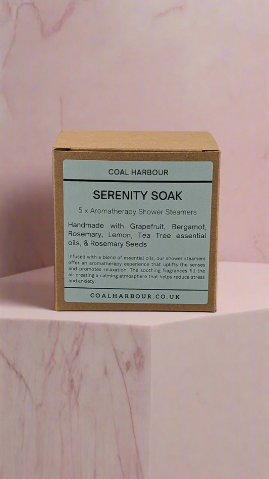 Box of Coal Harbour Serenity Soak on a pink marble background